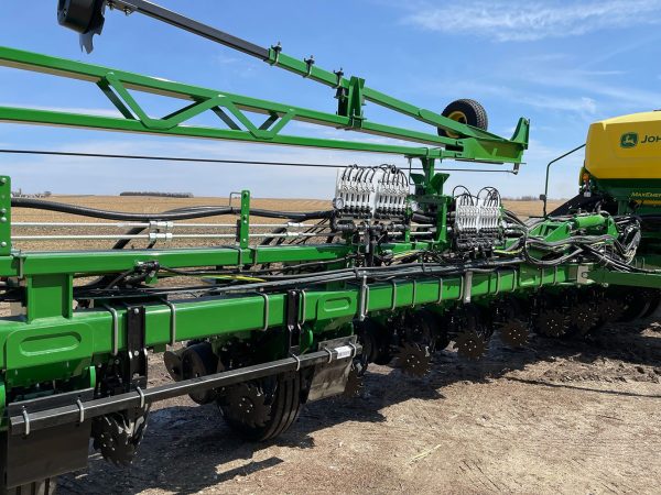 OnSite FMS dual product system mounted on the left wing of a 24 row John Deere planter